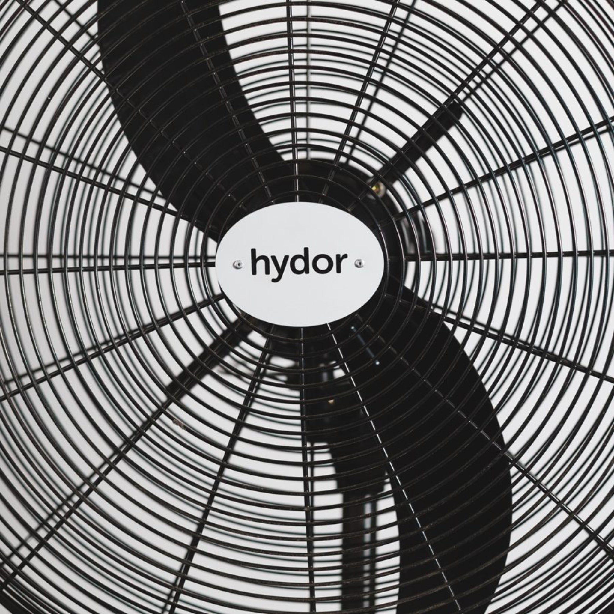 Close-up of the Hydor Hi-Flow 26-Inch Industrial Pedestal Fan showing protective grille and high-velocity fan blades, ideal for commercial ventilation and industrial air circulation.
