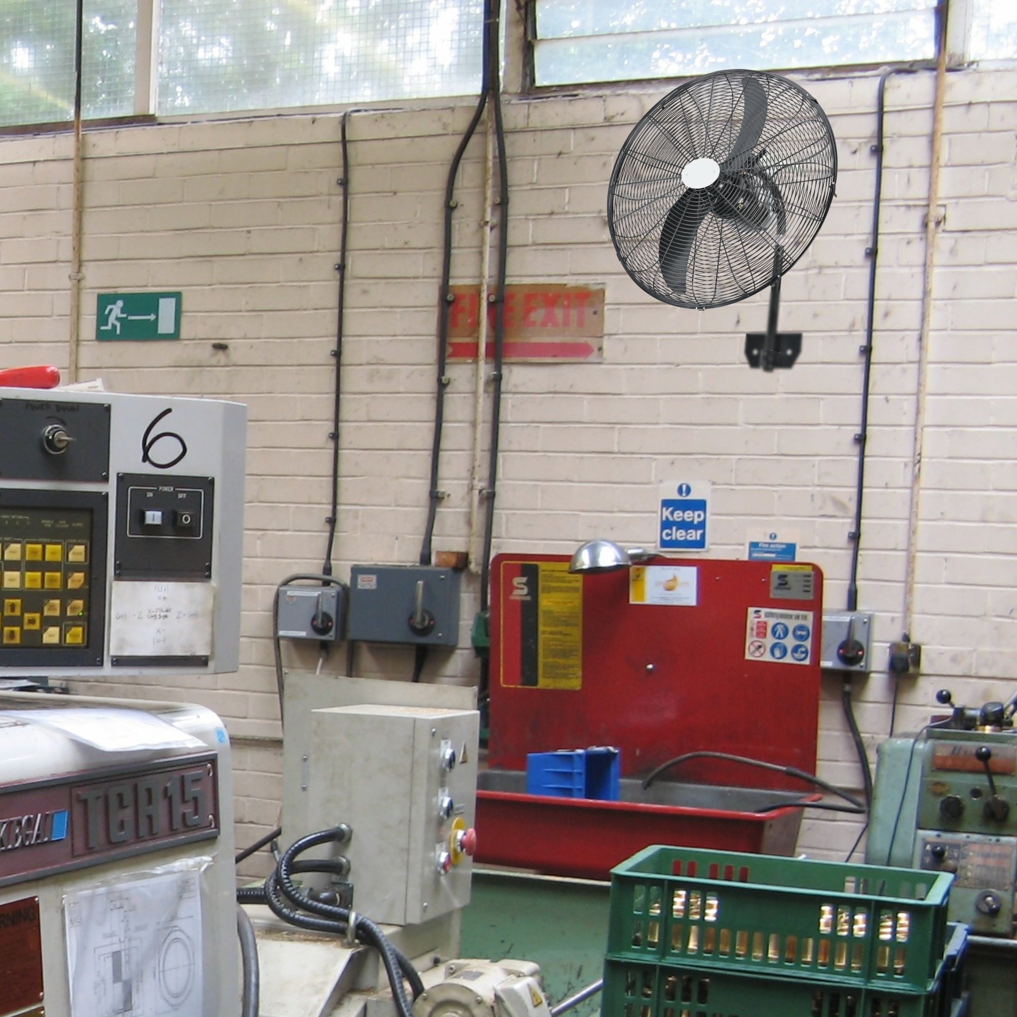 Hydor Hi-Flow 26-Inch (650mm) Industrial Wall-Mounted Fan installed in a busy workshop, demonstrating its space-saving wall mount design for high-velocity cooling in commercial environments.