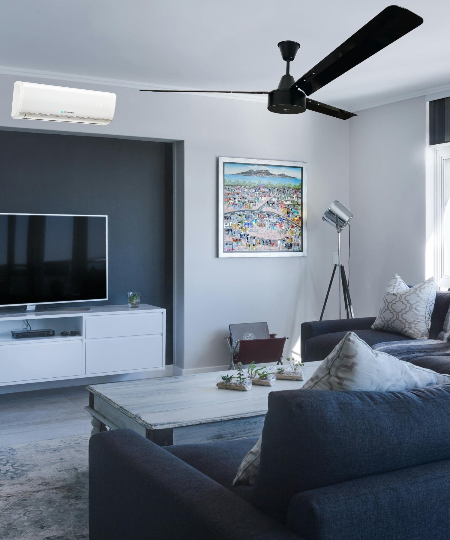 Living room with a large industrial ceiling fan and an Engas wall mounted air conditioner with heat pump, designed for powerful cooling in spacious environments.