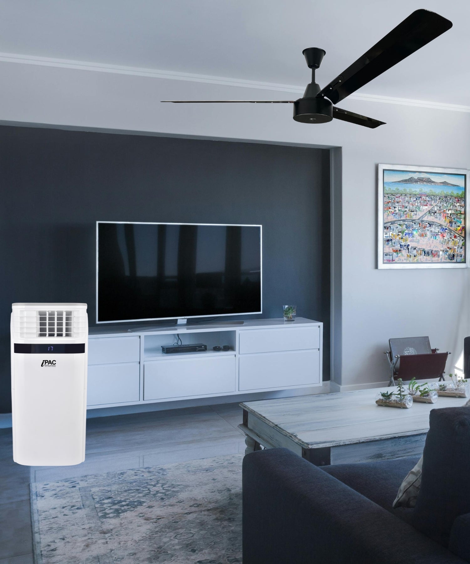 Living room with a large industrial ceiling fan and a portable air conditioner with heat pump, designed for powerful cooling in spacious environments.